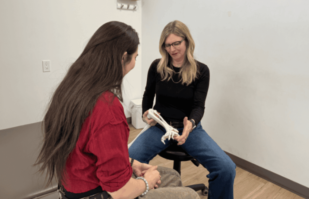therapist discussing bones with patient